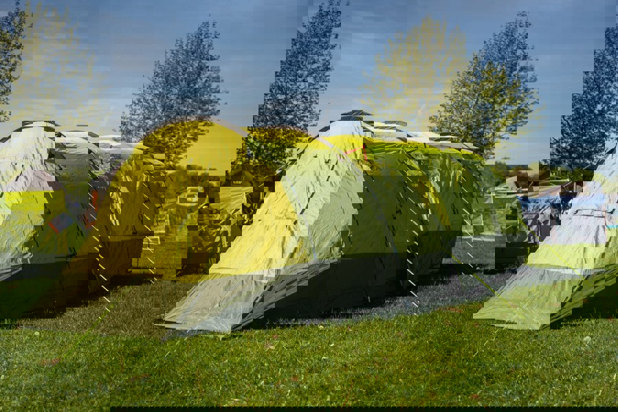 The Abberley XL 4 Berth Tent by OLPRO erected in a campsite with its doors closed.