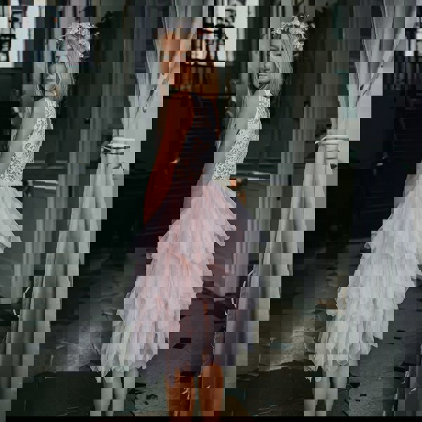 Pretty girl wearing dress and jewelled head piece