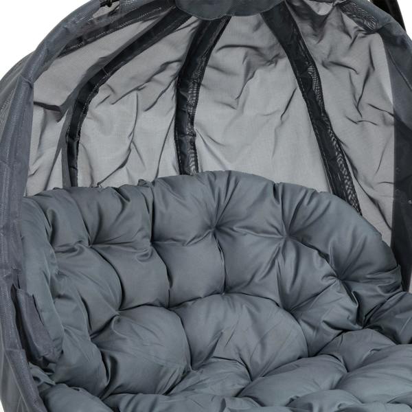 Light grey tufted cushion inside a grey hanging egg chair basket