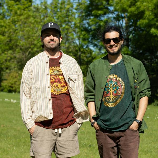 Green Tree of Life cotton T-shirt worn by a man outdoors