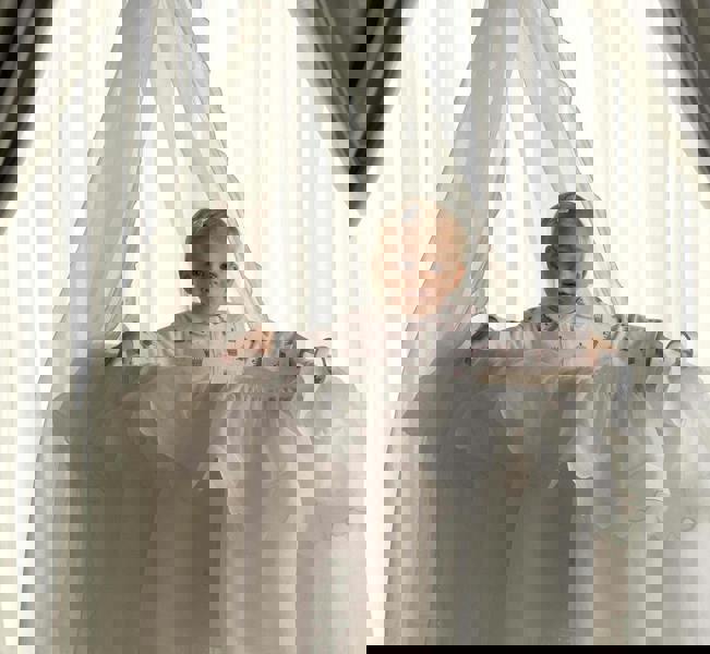 Baby wearing Princess crown print babygro