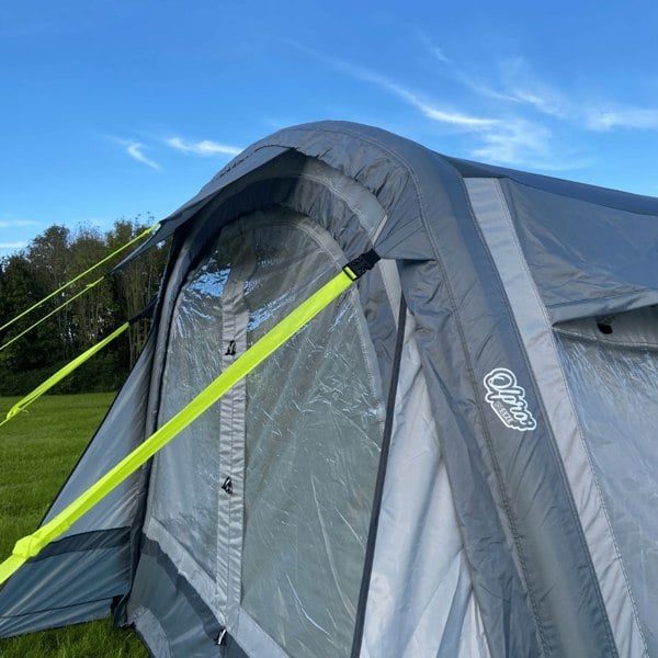 The Cocoon Breeze® XL v2 Motorhome Awning (Grey) from OLPRO pictured in a campsite attached to a VW Crafter Camper Van