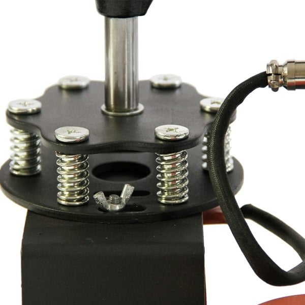 Close-up of a cap press machine showing metal springs, a sturdy base, and a heat element for printing designs on caps