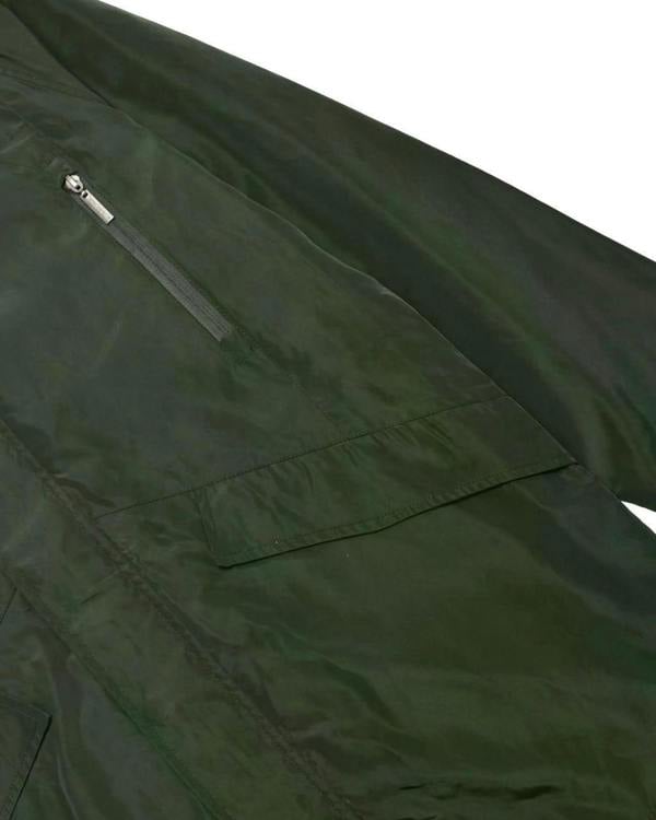 Lambretta Heaton Mens Shower-Resistant Mod Ska Hooded Lightweight Jacket Coat, close-up of dark green waterproof fabric with zipper pocket detail.