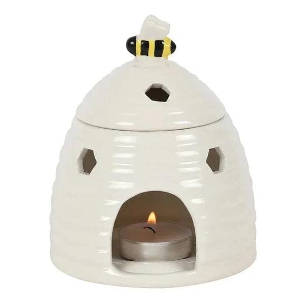 White beehive ceramic oil burner with bee-pattern lid and tealight opening