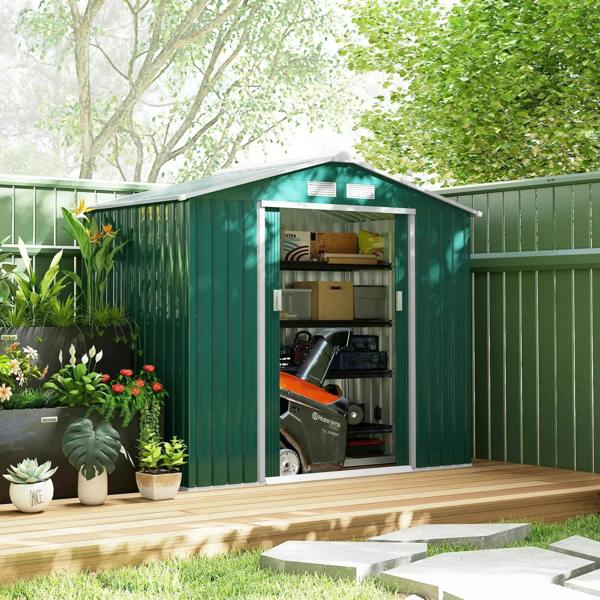 Green metal garden shed with double doors open, revealing shelves and stored items
