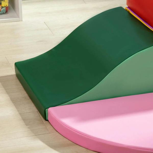 Green curved foam ramp with pink base pad for soft climbing and crawling