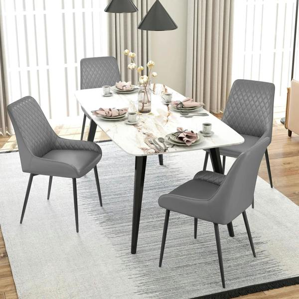 Set of 4 grey quilted dining chairs with black metal legs around a square table