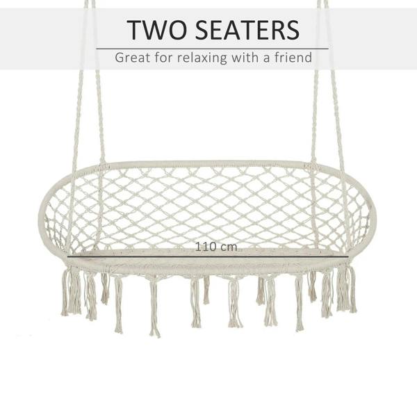 Cream hanging macrame hammock chair with oval net seat and long fringe tassels