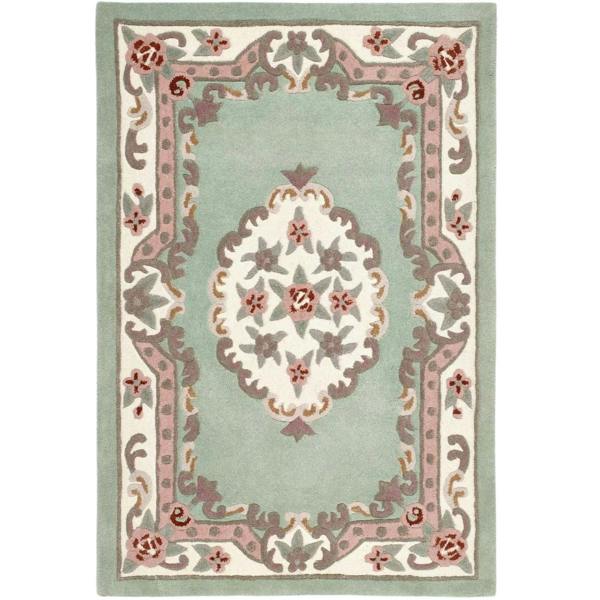 Decorative rug with floral patterns on a light green background