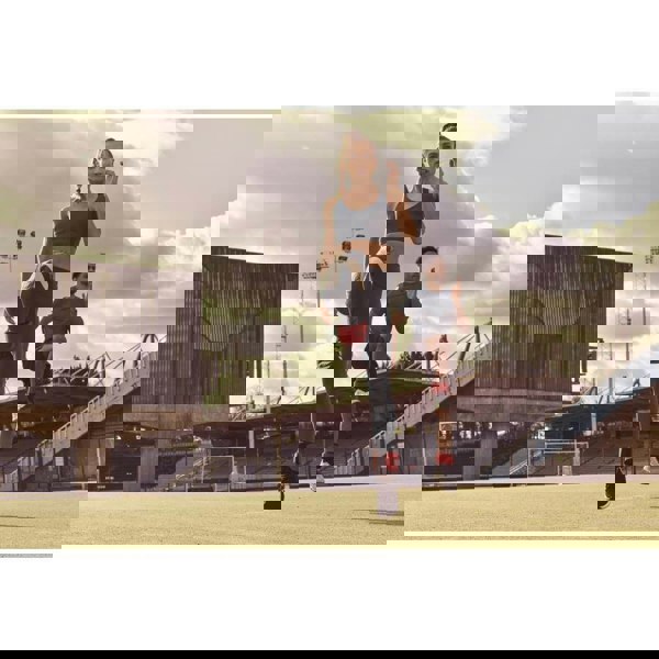 Man and woman working out wearing Reebok Flexlock Ankle Weights 0.5kg