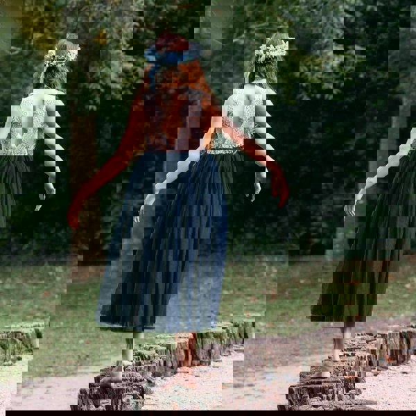 young girl wearing navy blue dress