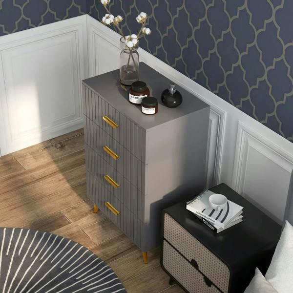 Dark grey 4-drawer dresser with embossed vertical lines and gold-tone bar handles, angled view