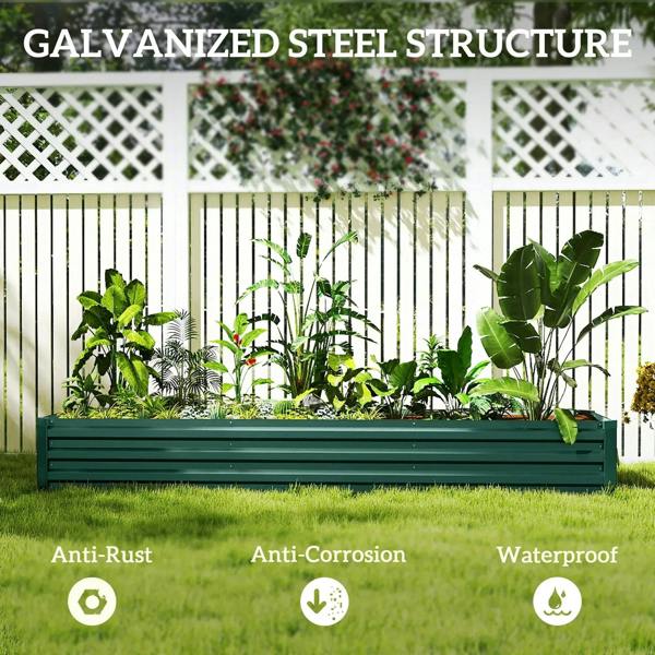 Green galvanized steel raised bed with open top and planted herbs in backyard.