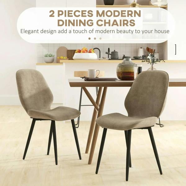 Set of 2 light brown velvet dining chairs with black legs in a dining setup
