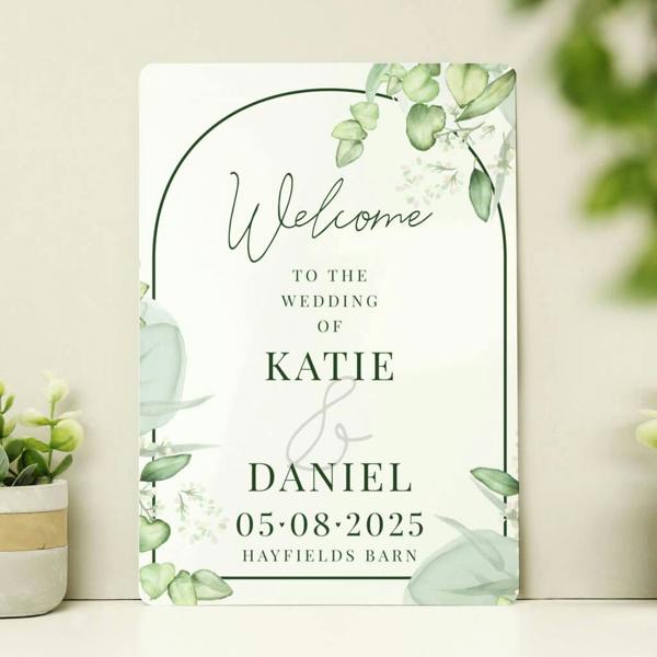 Personalised botanical wedding metal sign with an elegant arch design, eucalyptus leaves, and custom text for Katie and Daniel at Hayfields Barn