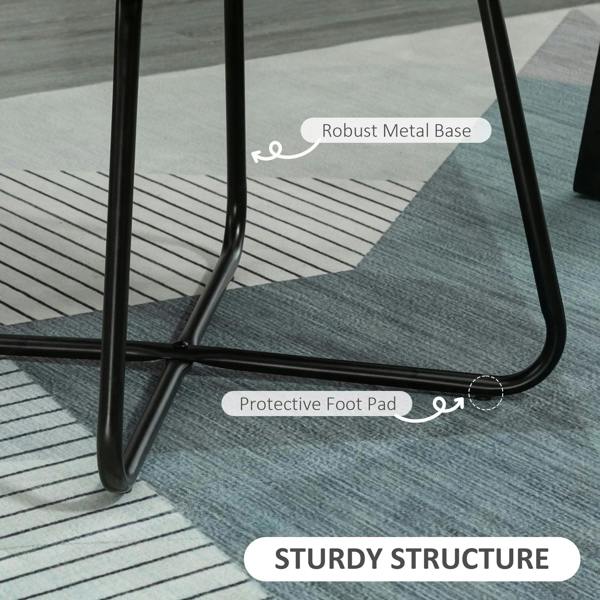 Black metal sled chair base with protective foot pads under grey upholstered seat