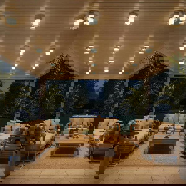 white outdoor ceiling mount light lighting up and outdoor seating area