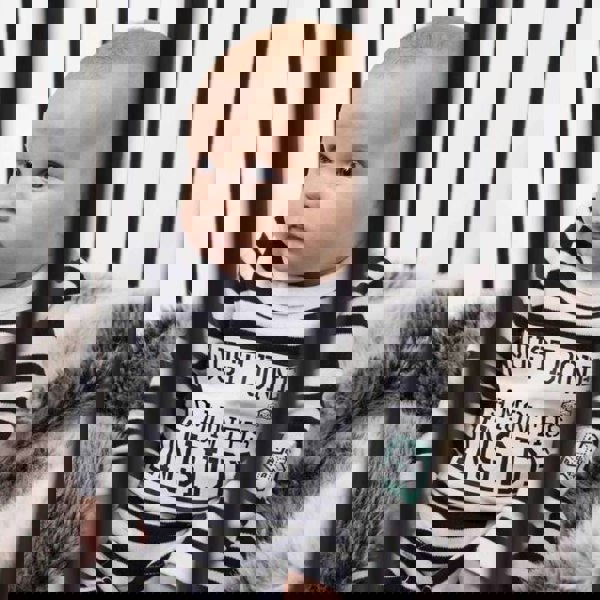 Baby Wearing Just Done 9 Months Inside Baby Grow Sitting in Cot Jail