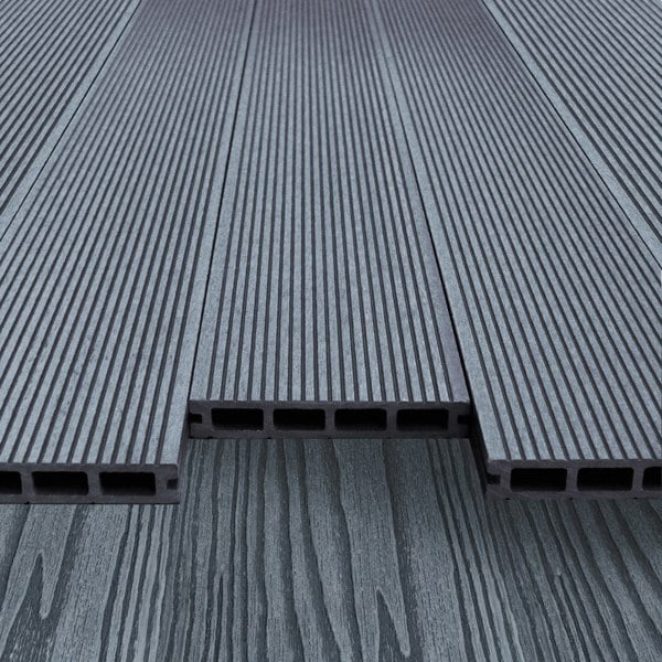 Grey composite decking boards with a textured surface and hollow design, showcasing durability and modern aesthetics for outdoor spaces