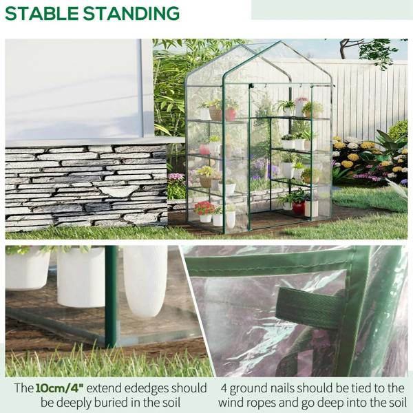 Freestanding greenhouse with clear cover and green metal frame with shelves