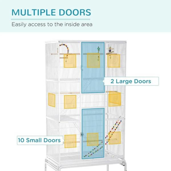 White bird cage with multiple access doors across 3 tiers and hanging toys