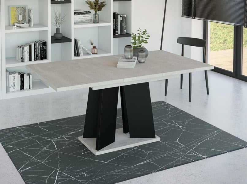 Compact extendable dining table 120 cm with industrial concrete-effect finish and matte black frame.