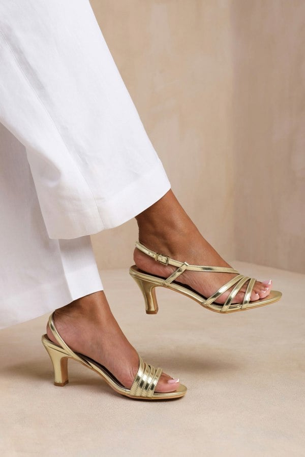 Where's That From Mykonos Wide Fit Mutli Strap Slingback Low Block Heel in Gold