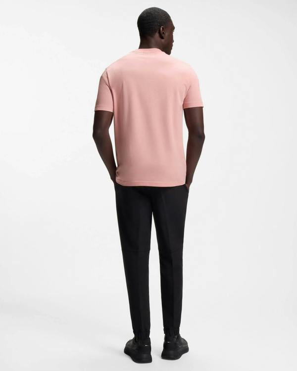 Model wearing BOSS Green Tee Mens Stretch Cotton T-Shirt with Contrast Logo in Light/Pastel Pink 686 - Back