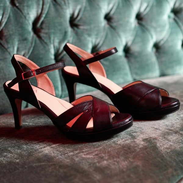 emily black heels photography on green background