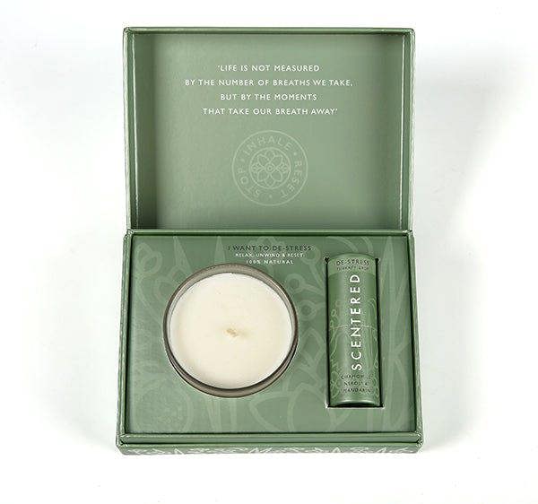 Scentered De-Stress gift set featuring a candle and therapy balm in calming green packaging with the quote ‘Life is not measured by the number of breaths we take, but by the moments that take our breath away.