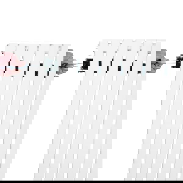 Flat single column radiator in white, 600 x 700mm, being cleaned with a brush, showcasing its sleek design and smooth finish