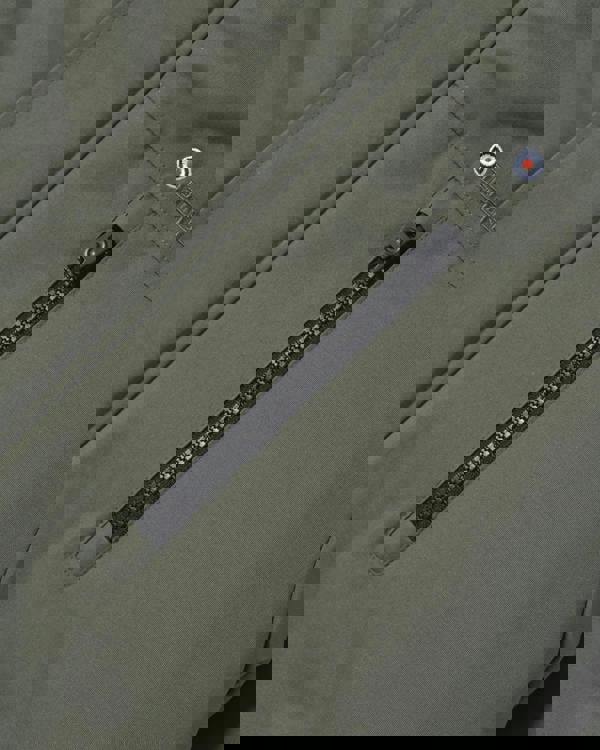 Lambretta Mens Utility Hooded Quilted Classic Badged Parka, close-up view of the olive-green jacket with a black zipper pocket and embroidered Lambretta badge.