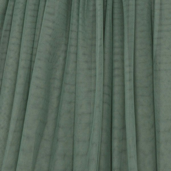 Green tulle fabric with a textured pattern