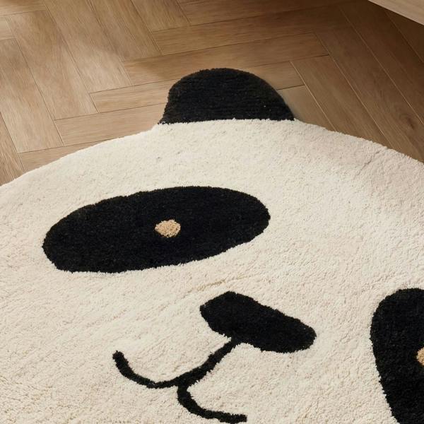 Panda-shaped rug on a wooden floor