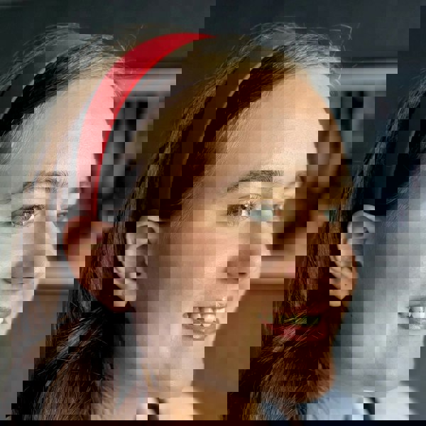 Red hair band, smooth satin fabric, padded wide band style, bold vibrant red colour, classic and striking accessory, comfortable everyday hairband
