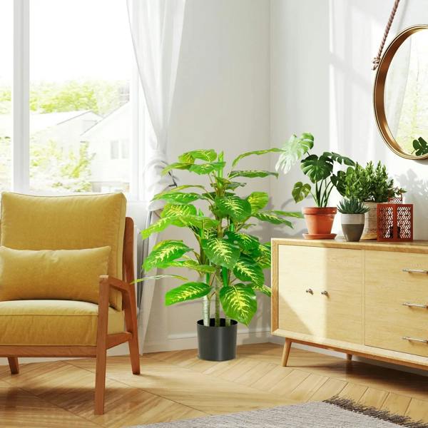 Faux rose plant with pots, green leafy plant in black pot in bright living room