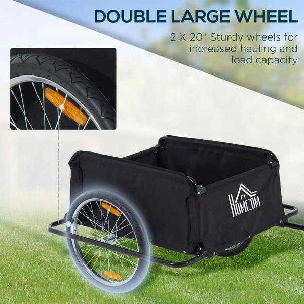 Black cargo trailer wagon with two large wheels and fabric side panels