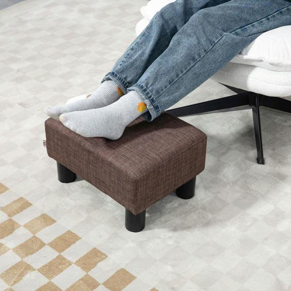Brown linen ottoman cube footrest with four black plastic legs and cushioned top