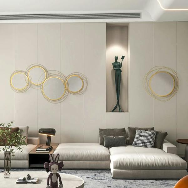 Gold tone circular metal wire wall mirror with stacked loop frame