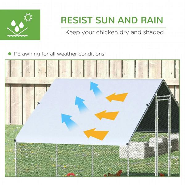 Chicken coop with grey weather cover roof and wire mesh enclosure, front door visible