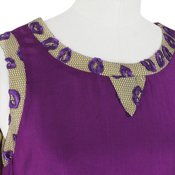 An embroidered lip and mesh edged dress by Giles