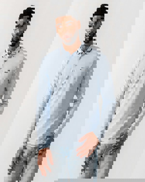 Model wearing BOSS Green Mens Plisy Long Sleeve Polo Shirt in Open Blue 464 - Main