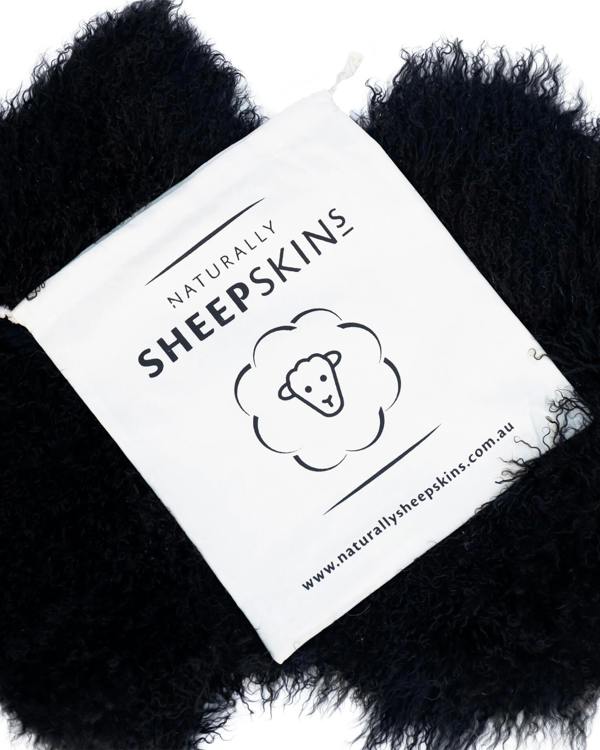 Canvas bag on Black Mongolian Sheepskin Rug