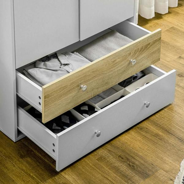 White wardrobe drawer open with wood front panel and metal pulls