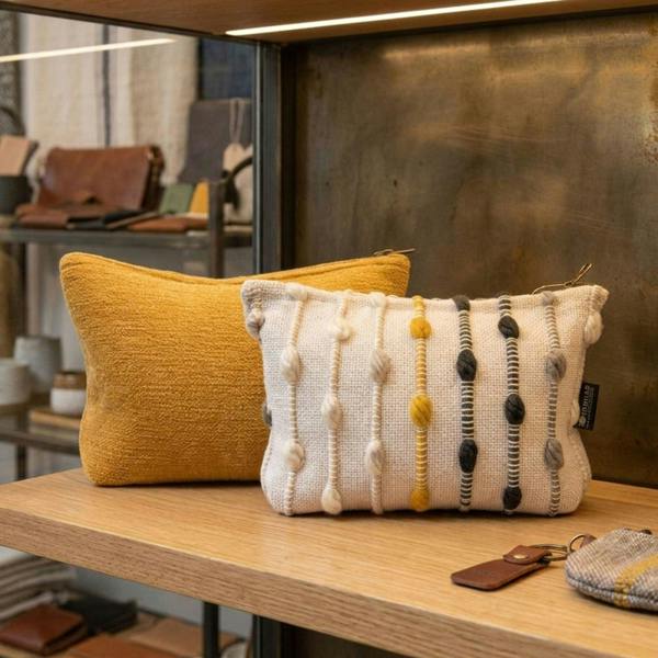 Mustard yellow and cream striped jacquard toiletry pouches with zipper closures