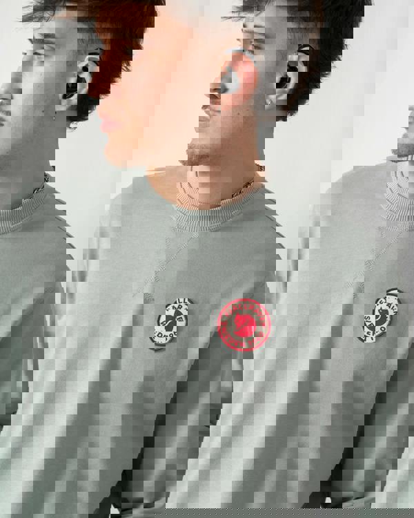 close up shot of a model wearing a Fjallraven 1960 Logo Badge Mens Sweatshirt in Misty Green 674