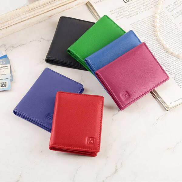 Six colorful wallets (red, blue, green, black, fuchsia,purple) on a light surface.