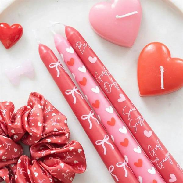 Set of three taper candles with pink and red hearts and bow prints