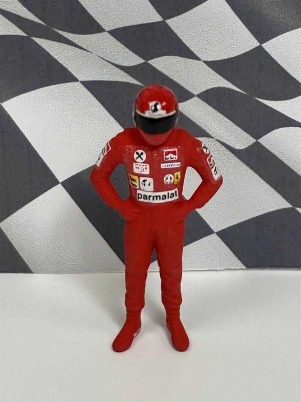 a toy figure in a red uniform